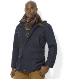 The vintage-inspired car coat features luxurious accents throughout, such as a full lining and suede piping. The vintage-inspired car coat features luxurious accents throughout, such as a full lining and suede piping.