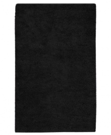 Nothing creates a more luxurious foundation than a rich, felted wool rug in sophisticated black. This plush piece features an undeniably soft hand, created with the finest hand-woven New Zealand wool. Nothing creates a more luxurious foundation than a rich, felted wool rug in sophisticated black. This plush piece features an undeniably soft hand, created with the finest hand-woven New Zealand wool.