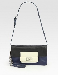 A luxurious leather style in a colorblocked design with detachable wristlet and shoulder strap.Detachable leather and chain wristlet strap, 7 dropDetachable adjustable shoulder strap, 8-10 dropSnap button flap closureThree inner compartmentsOne inside zip pocketOne inside open pocketFully lined8¼W X 4½H X 1DImported A luxurious leather style in a colorblocked design with detachable wristlet and shoulder strap.Detachable leather and chain wristlet strap, 7 dropDetachable adjustable shoulder strap, 8-10 dropSnap button flap closureThree inner compartmentsOne inside zip pocketOne inside open pocketFully lined8¼W X 4½H X 1DImported