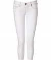 Add these bright white skinnies to your look for maximum style - Classic five-pocket styling, slim fit, cropped, logo-detailed back pockets - Style with a relaxed top, a leather jacket, and wedge booties