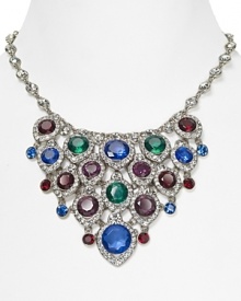 A true statement piece: this bold bib necklace from ABS by Allen Schwartz is an instant outfit-maker, crafted of plated metal with a cascade of colored gemstones. A true statement piece: this bold bib necklace from ABS by Allen Schwartz is an instant outfit-maker, crafted of plated metal with a cascade of colored gemstones.