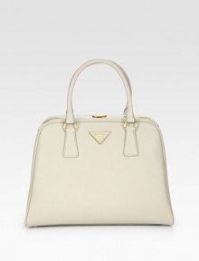Saffiano leather in a frame-top carryall with metal logo lettering.Double top handles, 5¼ dropTop clasp closureProtective metal feetTwo inside zip pocketsThree inside open pocketsLeather lining12¾W X 9¾H X 3¾DMade in Italy Saffiano leather in a frame-top carryall with metal logo lettering.Double top handles, 5¼ dropTop clasp closureProtective metal feetTwo inside zip pocketsThree inside open pocketsLeather lining12¾W X 9¾H X 3¾DMade in Italy
