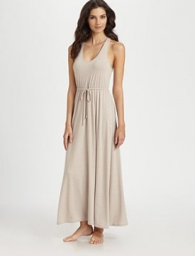 A figure-flattering silhouette of softly draped jersey fabric, with an unexpected sexy cross-over back. V-neckSleevelessRuched drawstring waistA-lineCrossed back with keyholeAbout 52 from shoulder to hem62% polyester/33% rayon/5% spandexMachine washImported A figure-flattering silhouette of softly draped jersey fabric, with an unexpected sexy cross-over back. V-neckSleevelessRuched drawstring waistA-lineCrossed back with keyholeAbout 52 from shoulder to hem62% polyester/33% rayon/5% spandexMachine washImported