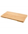 Regain lost counter space with this handy cutting board, crafted in bamboo wood to resist cuts marks and stand the test of time. Use it as a cutting board, trivet or serving tray with recessed side handles for easy movement. One-year limited warranty.