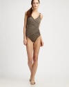 Featuring elegant draping that smoothes the figure, a timeless silhouette with the power of shapewear; this design flattens the tummy, slims hips and flatters the rear. Feminine v-neckAdjustable, convertible strapsSewn-in shelf braFully lined72% nylon/28% spandexHand washImported