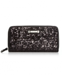 Every girl needs a little glamour on-the-go, and this shimmery sequin-embellished wallet from Nine West is the perfect choice. The slim design discretely slips into your bag, while plenty of interior pockets safely stow cards, cash, coins and ID without a worry. Every girl needs a little glamour on-the-go, and this shimmery sequin-embellished wallet from Nine West is the perfect choice. The slim design discretely slips into your bag, while plenty of interior pockets safely stow cards, cash, coins and ID without a worry.