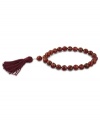 Totally on trend! Tassels are the thing this season, and this crimson-colored tassel and carnelian bead bracelet (109-3/8 ct. t.w.) completes the look. Set in 18k gold over sterling silver. Bracelet stretches to fit wrist. Approximate diameter: 2-1/4 inches. Approximate length: 7-1/2 inches.
