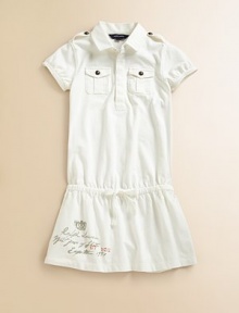 A drop-waist dress with rugby-inspired details for the perfect mix of utility and girlie style.Shirt collarShort sleevesShoulder epauletsFront button placketButton flap-bellows pockets at chestDrop-waist drawstring with grosgrain ribbon tieCottonMachine washImported Please note: Number of buttons may vary depending on size ordered. 
