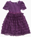 Ruffles fall down the skirt of this tiered dress from Sweet Heart Rose, giving her a flowing style she'll love to show off.