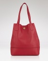 Tory Burch's uptown style shines by day with this tote. Crafted of leather and sized to take anywhere (and carry everything,) this must-have is oh so ready to carry on.
