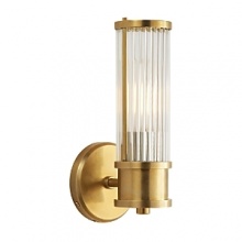 The elongated design and warm natural brass of this Ralph Lauren sconce lends luxurious light to any space. The elongated design and warm natural brass of this Ralph Lauren sconce lends luxurious light to any space.