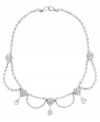 Definitively dazzling. Embellished with glittering Swarovski crystals, you'll make an elegant entrance in this striking swag collar necklace from Monet. Crafted in silver tone mixed metal. Approximate length: 17 inches.