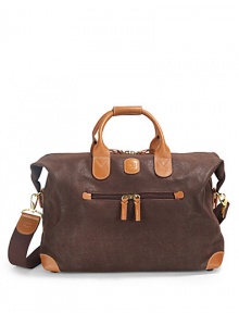 THE LOOKClassic duffel shapeLeather double top handlesRemovable webbed cotton shoulder strapRemovable luggage tagTop zip closureOne outside zip pocketSide snapsProtective feetOne inside zip pocketTHE MEASUREMENTDouble top handles, 5 dropRemovable, adjustable shoulder strap, 13-25 drop23W X 13H X 7DTHE MATERIALPVCLeather trimFully linedORIGINImported THE LOOKClassic duffel shapeLeather double top handlesRemovable webbed cotton shoulder strapRemovable luggage tagTop zip closureOne outside zip pocketSide snapsProtective feetOne inside zip pocketTHE MEASUREMENTDouble top handles, 5 dropRemovable, adjustable shoulder strap, 13-25 drop23W X 13H X 7DTHE MATERIALPVCLeather trimFully linedORIGINImported