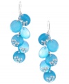 Wash your blues away with a bright pop of color. Kenneth Cole New York's stunning shaky earrings feature turquoise-colored resin circles accented by crystals. Set in silver tone mixed metal. Approximate drop: 2-4/10 inches.