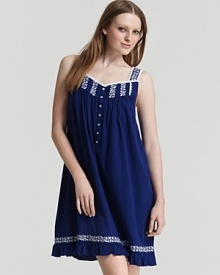 Sweet dreams start with a short sleeveless gown with lace trim and embroidered detail.