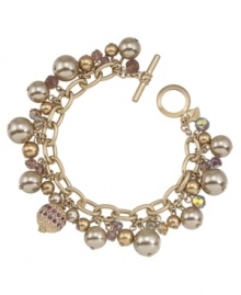 Shift into neutral. A pretty palette of beige and gold makes Carolee's chic charm flex bracelet ideally suited for mixing and matching with your wardrobe. Crafted in gold tone mixed metal, it's embellished with glass accents and imitation pearls. Includes a toggle closure. Approximate length: 7-1/2 inches. Shift into neutral. A pretty palette of beige and gold makes Carolee's chic charm flex bracelet ideally suited for mixing and matching with your wardrobe. Crafted in gold tone mixed metal, it's embellished with glass accents and imitation pearls. Includes a toggle closure. Approximate length: 7-1/2 inches.