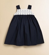 A sweet and simple frock offers a little fuss with lace detail along the neckline.Squareneck with scalloped lace detailWide strapsBack buttonsEmpire waist with back bow tie65% polyester/35% cottonMachine wash coldImported Please note: Number of buttons may vary depending on size ordered. 