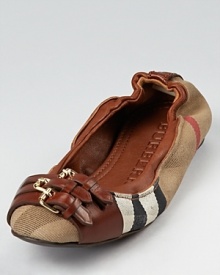 Burberry's signature check print gets dressed up in leather buckles on these comfortable, classic flats.