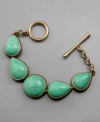 Pump up your look with subtle vintage style. This bracelet by Lucky Brand features turquoise howlite set in vintage worn goldtone mixed metal with a toggle & bar closure.  Approximate length: 7-5/8 inches.