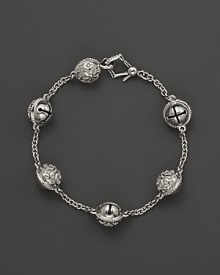 Inspired by Zen philosophy, this intricately detailed sterling silver bracelet from Paul Morelli softly jingles with meditation bells. Inspired by Zen philosophy, this intricately detailed sterling silver bracelet from Paul Morelli softly jingles with meditation bells.