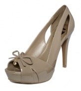 Cute as a doll. The Craft platform pumps from G by GUESS reveal your sweet side with their cute cut-out details and bow with logo charm accent.
