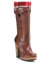 Sleek and shapely, Lucky Brand's stacked-heel leather boots fold over to reveal a cozy plaid lining.