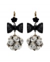 Bring a little Studio 54 flavor to the table with chic disco ball-inspired earrings.  Flashy crystal fireballs dangle from bold, black ribbon and flower drops. Betsey Johnson earrings crafted in antique gold tone mixed metal. Approximate drop: 1-1/2 inches.