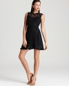 This feminine Nanette Lepore dress showcases attention to detail with delicate lace and a fringed hem.