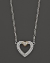 Modern open heart pendant necklace with white sapphires and 18 Kt. gold accents. Designed by Judith Ripka.