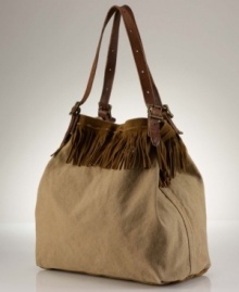 Denim & Supply Ralph Lauren's slouchy, oversized canvas tote gets a couture touch with swingy suede fringe detailing and supple leather accents that owe their inspiration to wilderness roots.