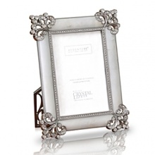 Give your pictures the attention they deserve. This spectacular genuine mother of pearl frame is encrusted with handset Swarovski crystals in a fleur de lis corner pattern. An additional inset of studded crystals adds a luxurious touch. Give your pictures the attention they deserve. This spectacular genuine mother of pearl frame is encrusted with handset Swarovski crystals in a fleur de lis corner pattern. An additional inset of studded crystals adds a luxurious touch.