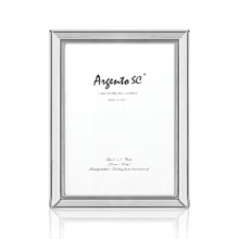 Timeless and refined, this sterling silver frame makes an exceptional gift, even if it's for yourself. Use it to frame your favorite photos or to display a special invitation. Timeless and refined, this sterling silver frame makes an exceptional gift, even if it's for yourself. Use it to frame your favorite photos or to display a special invitation.