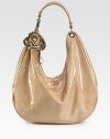 Lustrous patent leather in slouchy carryall topped with polished silvertone rings.Shoulder strap with hook, 7½ dropTop-zip closureOne inside zip pocketOne inside open pocketSuede lining16¾W X 12¼H X 5¾DMade in Italy