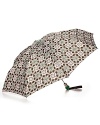 A stylish batik printed umbrella with a green logo handle and button top.