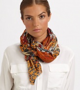 A lightweight cashmere and silk blend wrap is adorned with a vivid, tribal-inspired print and eyelash trim.55% cashmere/45% silk28 X 80Dry cleanImported