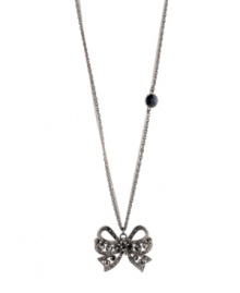 Glittering and gorgeous. Enhance your style with Betsey Johnson's sparkling crystal-adorned bow pendant necklace. Crafted in hematite tone mixed metal. Approximate length: 32 inches + 3-inch extender. Approximate drop: 1-3/4 inches.