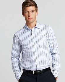 This elegant Michael Kors tailored shirt boasts a slim fit and sky blue alternating stripe pattern. This elegant Michael Kors tailored shirt boasts a slim fit and sky blue alternating stripe pattern.