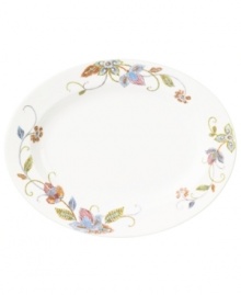 Well-crafted blooms create the illusion of texture on the sleek white porcelain of Oleg Cassini's Kavita oval platter. A charming complement to the dinnerware collection. Well-crafted blooms create the illusion of texture on the sleek white porcelain of Oleg Cassini's Kavita oval platter. A charming complement to the dinnerware collection.