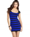 Bold stripes and a body-hugging fit lends sleek factor to a hot dress from Guess?.