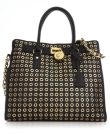 Destined to delight, this classic carryall from MICHAEL Michael Kors is dressed in golden grommets and signature detailing. Ultra-spacious with plenty of pockets, it's designed to meet all your daily demands. Destined to delight, this classic carryall from MICHAEL Michael Kors is dressed in golden grommets and signature detailing. Ultra-spacious with plenty of pockets, it's designed to meet all your daily demands.