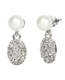 Two elegant classic combine in these eye-catching earrings by Monet. Crafted in silvertone mixed metal, oval medallions encrusted with pave crystal suspend from lustrous glass pearl. Approximate drop: 1-1/2 inches. Two elegant classic combine in these eye-catching earrings by Monet. Crafted in silvertone mixed metal, oval medallions encrusted with pave crystal suspend from lustrous glass pearl. Approximate drop: 1-1/2 inches.