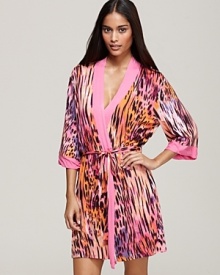 A vibrant animal print wrap with contrast pink trim, a fierce bedtime look from Josie. A vibrant animal print wrap with contrast pink trim, a fierce bedtime look from Josie.