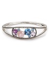 A striking bangle is just the thing to enliven your wardrobe. This simple silver style from Judith Jack features multi colored stones and a shapely design.