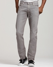 These straight leg 7 for All Mankind jeans in a faded gray wash sit low on the waist with a slim fit through hip and thigh and slight tapering at the ankle. Back pocket signature squiggle detail.
