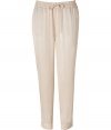 Stylish pants in fine, pure viscose - Sumptuously soft, lightweight material in classic nude - Slim yet relaxed, low rise cut - Gathered drawstring waist - Slash pockets at sides, welt pockets at rear - Fashionable 7/8 length crops at ankles - Casually elegant, easily dressed up or down - Pair with a fitted t-shirt and leather sandals, or try a silk tank, blazer and wedges