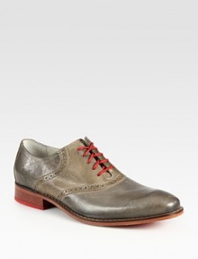 Burnished leather and contrast lacing overtake this classic saddle shoe lending endless style possibilities.Leather upperLeather liningPadded insoleRubber soleImported