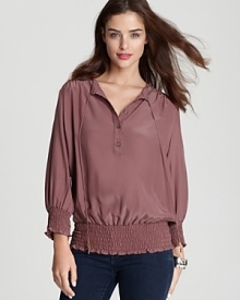 It's all in the details with this Akiko silk top, featuring smocking, buttons and ties at the neck. It's all in the details with this Akiko silk top, featuring smocking, buttons and ties at the neck.