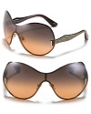 Miu Miu's shield sunglasses with a sleek and curvy silhouette and glittery arms are sure to turn heads.