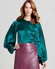 Billowy pleated sleeves add romantic appeal to this jewel-toned Anne Klein Collection silk blouse. Style with slim trousers at the office or toughen it up with an attention-grabbing leather skirt for drinks downtown.