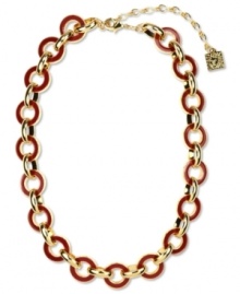 Link together haute fashion. This chunky collar necklace from Anne Klein flaunts red enamel links for a bold look. Crafted in gold tone mixed metal. Approximate length: 16 inches + 3-inch extender. Link together haute fashion. This chunky collar necklace from Anne Klein flaunts red enamel links for a bold look. Crafted in gold tone mixed metal. Approximate length: 16 inches + 3-inch extender.
